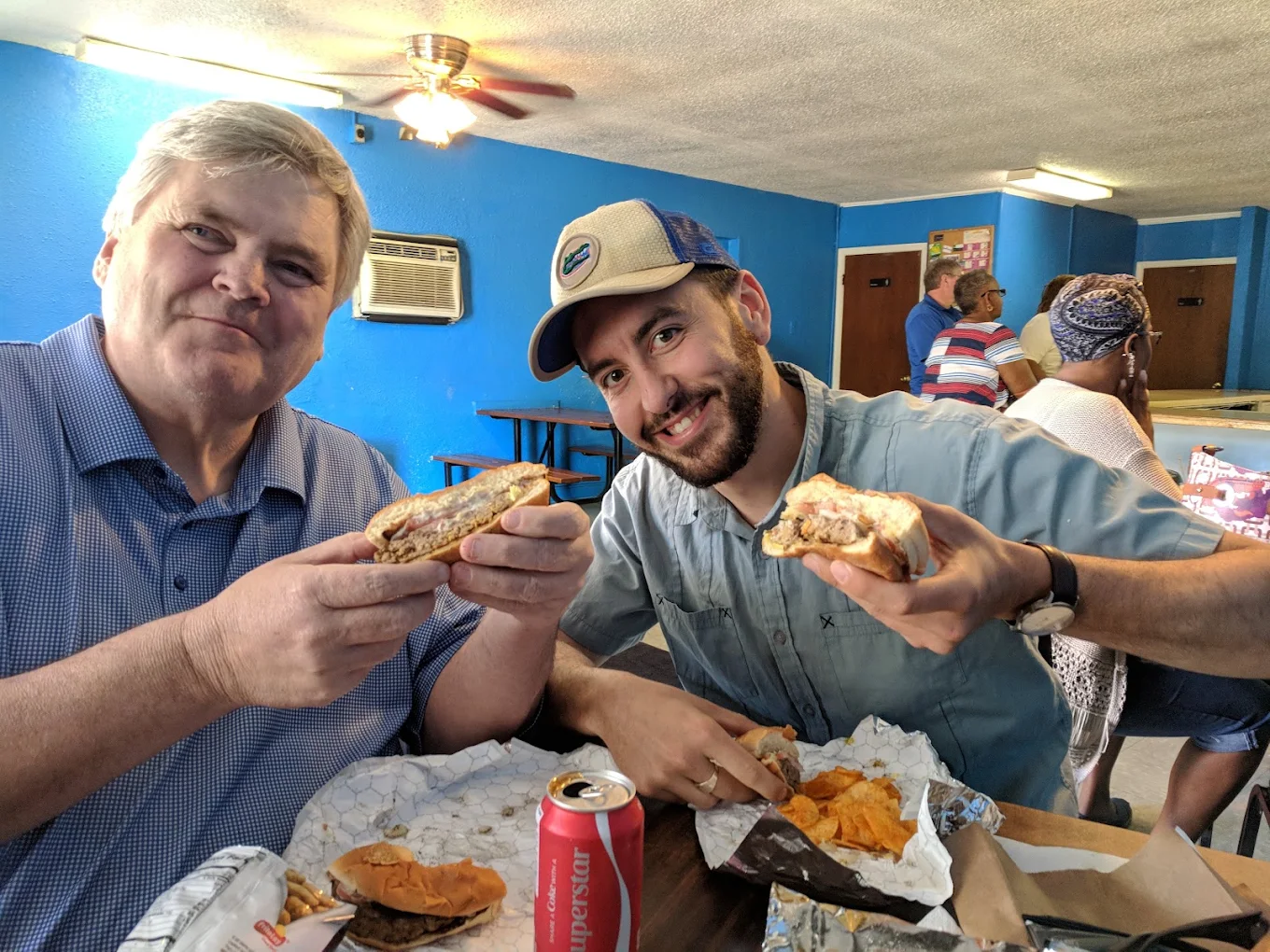 Customers enjoying Blue Dot burgers